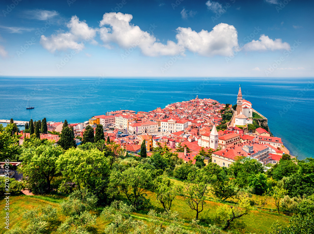 Aerial view of old town Piran. Splendid spring morning on Adriatic Sea. Beautiful cityscape of Slovenia, Europe. Traveling concept background. Magnificent Mediterranean landscape.