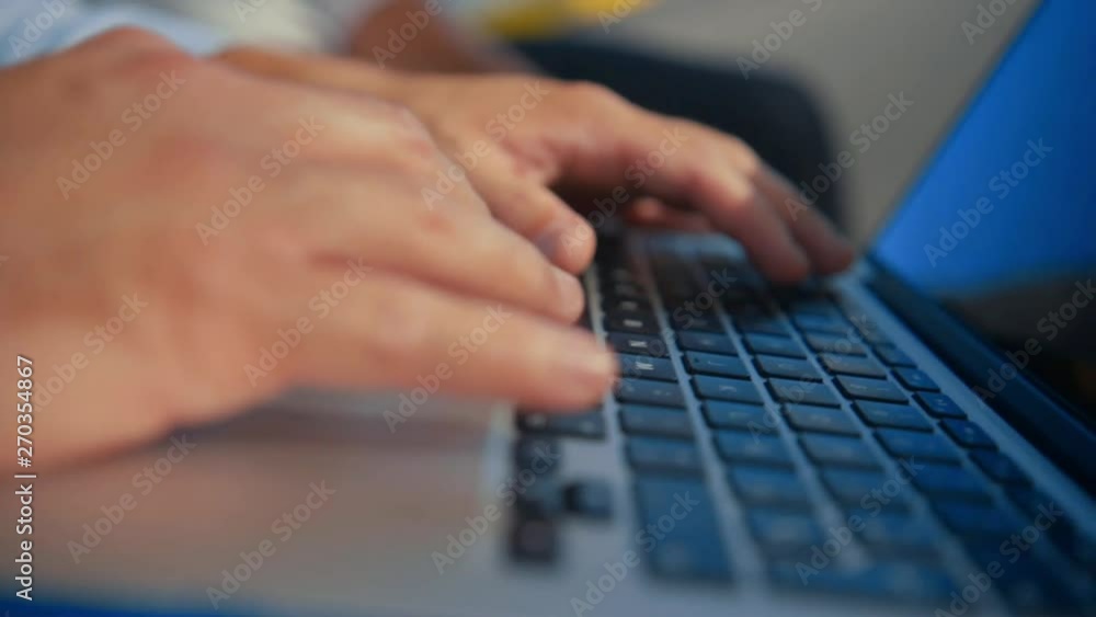 slowmotion Hand using a trackpad computer outdoors slowmotion Hand using a trackpad computer outdoors