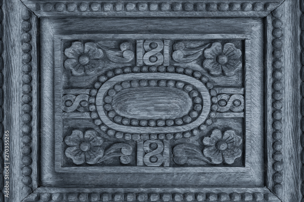 Vintage wood background with carving. Fragment of carved  door in Church, Greece.