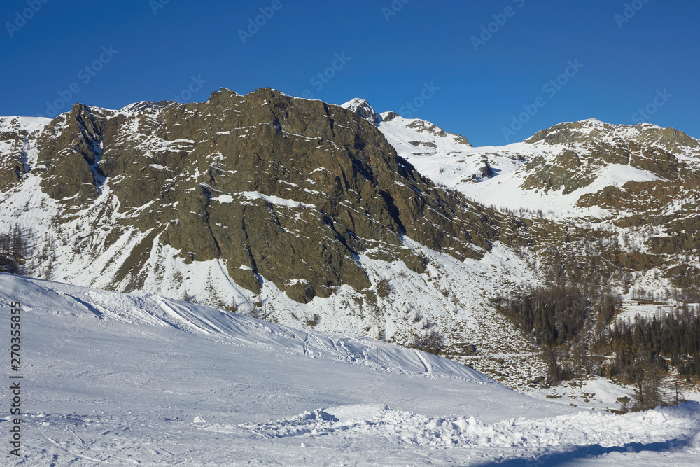 In the top of the mountain in Italy - winter season - adventure snow - Aosta - Champorcher.