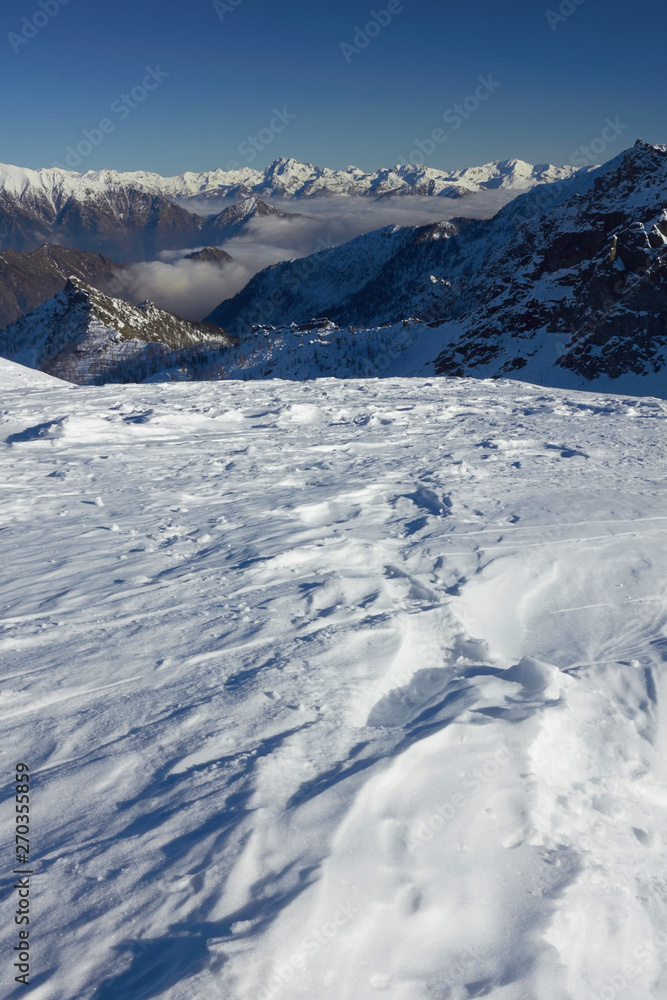 In the top of the mountain in Italy - winter season - adventure snow - Aosta - Champorcher.
