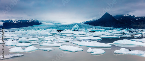 Floating ice box on the Fjallsarlon glacial lagoon. Sunny morning panorama of Vatnajokull National Park, southeast Iceland, Europe. Beauty of nature concept background.