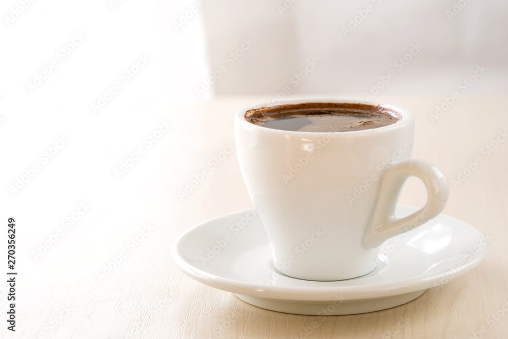 A cup of coffee on a light beige background. Template for design, menu. A cup of coffee on a light beige background. Template for design, menu.