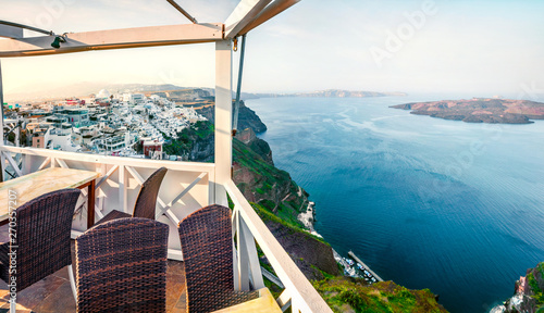Sunny morning view of Santorini island. Picturesque spring scene of the famous Greek resort Fira, Greece, Europe. Traveling concept background.