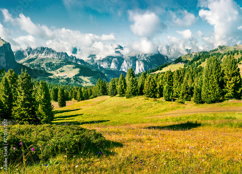 Wonderful summer scene with Furchetta mountain range in the morning mist. View Great view of Dolomite Alps from Sella pass, Italy, Europe. Beauty of nature concept background. © Andrew Mayovskyy
