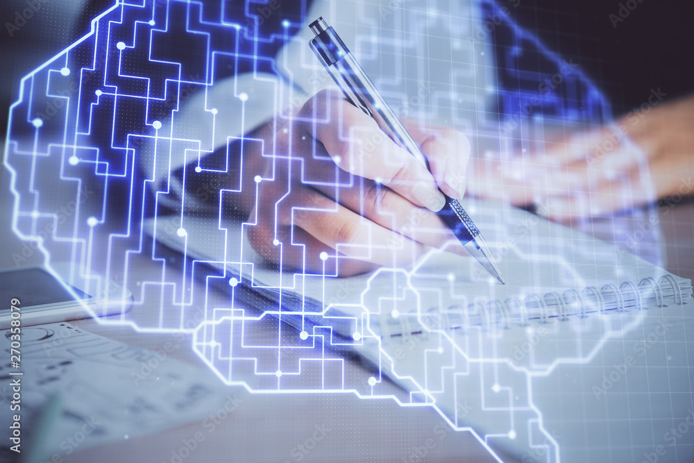 Double exposure of woman's writing hand on background with brain hud. Concept of learning. Double exposure of woman's writing hand on background with brain hud. Concept of learning.