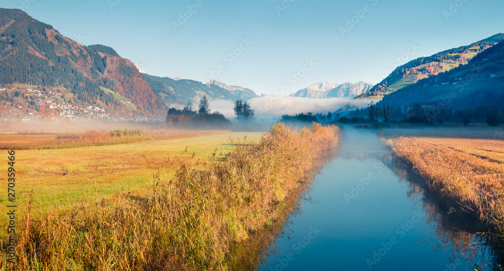 Sunny morning scene near Zell lake. Picturesque autumn view of Austrian Alps. Beauty of nature concept background.