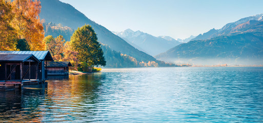 Sunny morning panorama of Zell lake. Picturesque autumn view of Austrian Alps, with Grossglockner peak on background. Beauty of nature concept background.