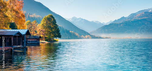 Fototapeta Naklejka Na Ścianę i Meble -  Sunny morning panorama of Zell lake. Picturesque autumn view of Austrian Alps, with Grossglockner peak on background. Beauty of nature concept background.