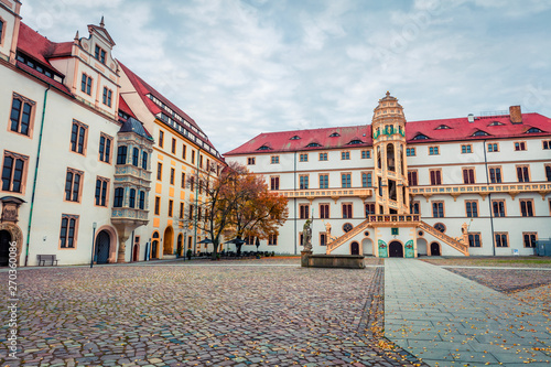 Splendid autumn view of Hartenfels castle. Picturesque morning view of Torgau town on the banks of the Elbe in northwestern Saxony, Germany. Traveling concept background.