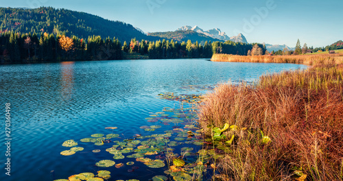 Splendid morning scene of Wagenbruchsee lake with Zugspitze mountain range on background. Beautifel autumn view of Bavarian Alps, Germany, Europe. Beauty of nature concept background.