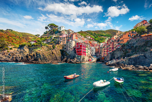 Fototapeta Naklejka Na Ścianę i Meble -  First city of the Cique Terre sequence of hill cities - Riomaggiore. Colorful morning view of Liguria, Italy, Europe. Great spring seascape of Mediterranean sea. Traveling concept background.