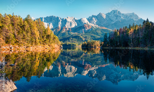 Bright evening scene of Eibsee lake with Zugspitze mountain range on background. Beautifel autumn view of Bavarian Alps, Germany, Europe. Beauty of nature concept background. photo