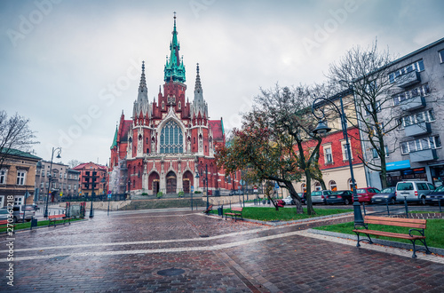 Dramatic autumn view of Parish of St. Joseph church. Rainy morning cityscape of Krakow, Poland, Europe. Traveling concept background.