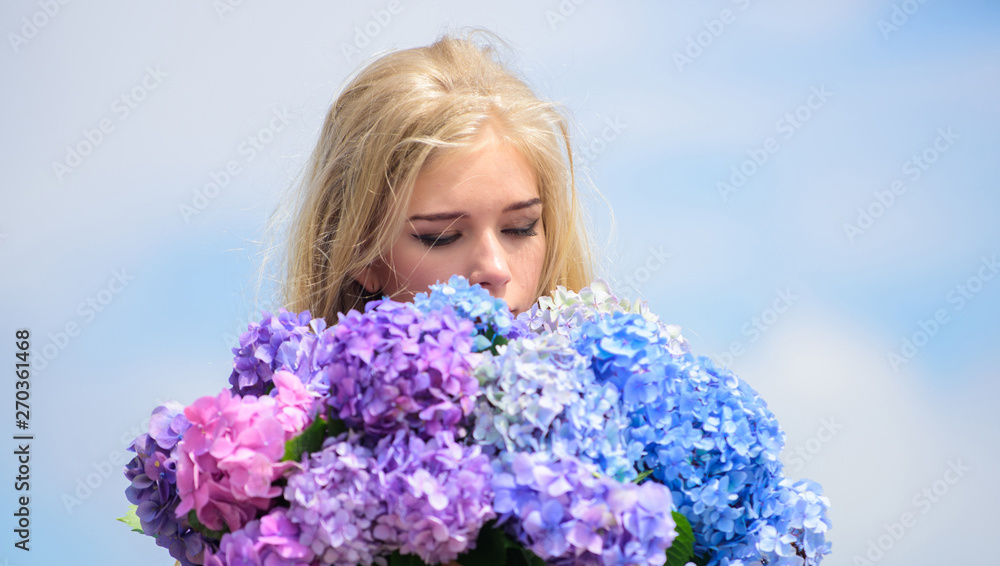 Springtime bloom. Natural beauty concept. Skin care and beauty treatment. Gentle flower for delicate woman. Pure beauty. Tenderness of young skin. Girl tender blonde hold hydrangea flowers bouquet Springtime bloom. Natural beauty concept. Skin care and beauty treatment. Gentle flower for delicate woman. Pure beauty. Tenderness of young skin. Girl tender blonde hold hydrangea flowers bouquet