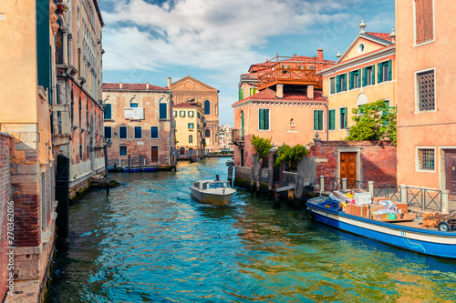 Bright spring view of Vennice with famous water canal and colorful houses. Splendid morning scene in Italy, Europe. Magnificent Mediterranean cityscape. Traveling concept background. photo