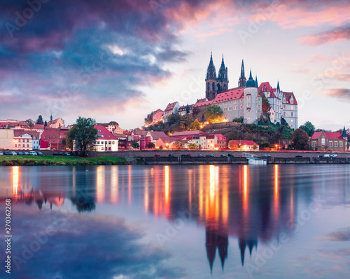 Dramatic autumn sunset view of oldest overlooking the River Elbe castle - Albrechtsburg. Colorful veneig cityscape of Meissen, Saxony, Germany, Europe. Traveling concept background.