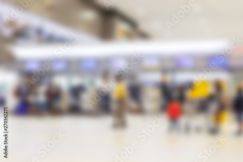 Blurred of passengers walk in to check-in counter on domestic airline in the airport
