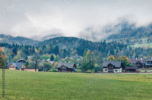 Foggy autumn view of Brauhof village. Amazing morning scene of Austrian Alps, Styria stare of Austria, Europe. Beauty of countryside concept background. Instagram filter toned.
