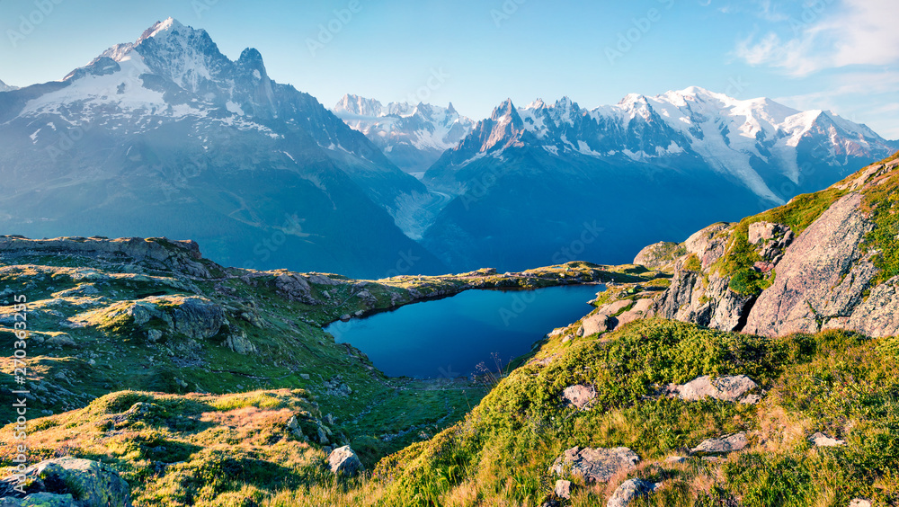 Breathtaking summer view of the Lac Blanc lake with Mont Blanc (Monte Bianco) on background, Chamonix location. Beautiful outdoor scene in Vallon de Berard Nature Preserve, Graian Alps, France.