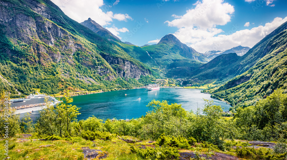 Splendid summer scene of Geiranger port, western Norway. Aerial morning view of Sunnylvsfjorden fjord. Traveling concept background. Artistic style post processed photo.