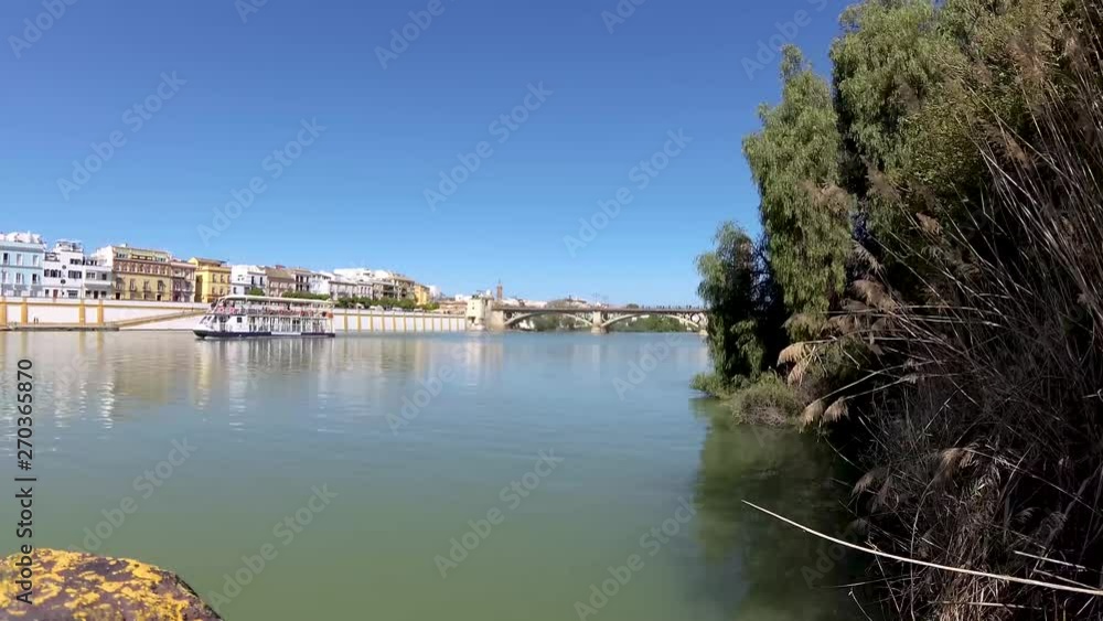 Turist boat on the Guadalquivir river, Seville, Spain Turist boat on the Guadalquivir river, Seville, Spain
