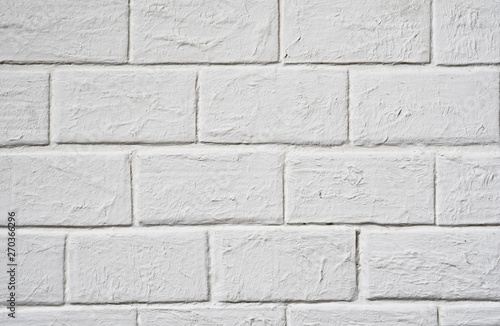 Textural background: white brick wall close up