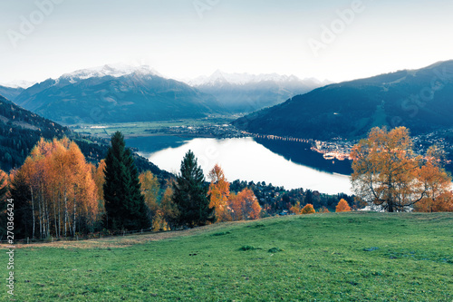Stunning view of Zell lake. Impressive autumn scene of Austrian town - Zell am See, south of the city of Salzburg. Beauty of nature concept background. Instagram filter toned.