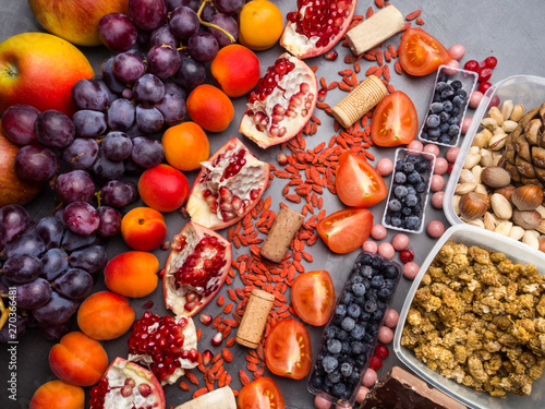 Fototapeta Naklejka Na Ścianę i Meble -  Healthy food clean eating selection: fruits,, superfood, nuts on gray concrete background