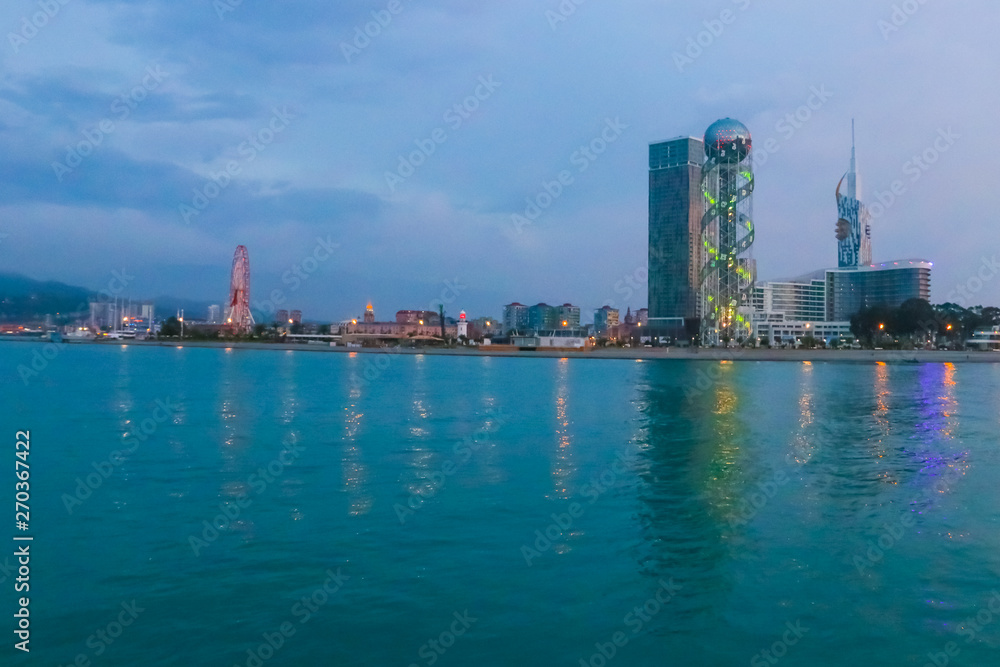 Batumi, Adjara, Georgia. View from the sea on illuminated resort town at evening