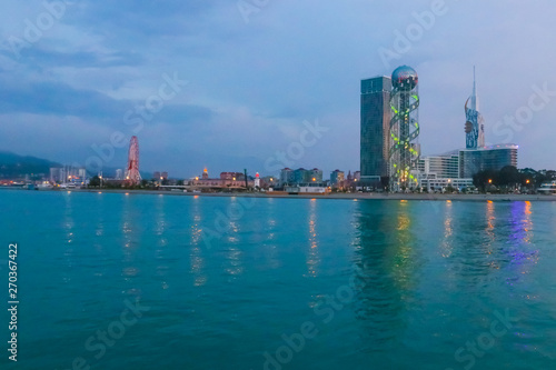 Batumi, Adjara, Georgia. View from the sea on illuminated resort town at evening © olyasolodenko