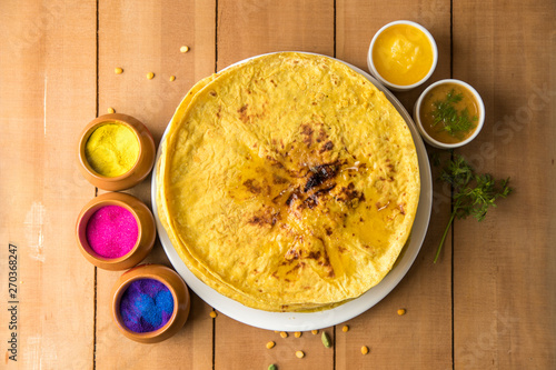 Holi festival, Traditional Maharashtrian food on the occasion of Holi. Puranpoli made of Jaggery. And cold drink made of curd. photo