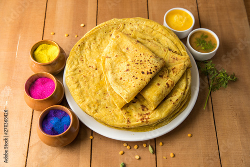 Holi festival, Traditional Maharashtrian food on the occasion of Holi. Puranpoli made of Jaggery. And cold drink made of curd. photo