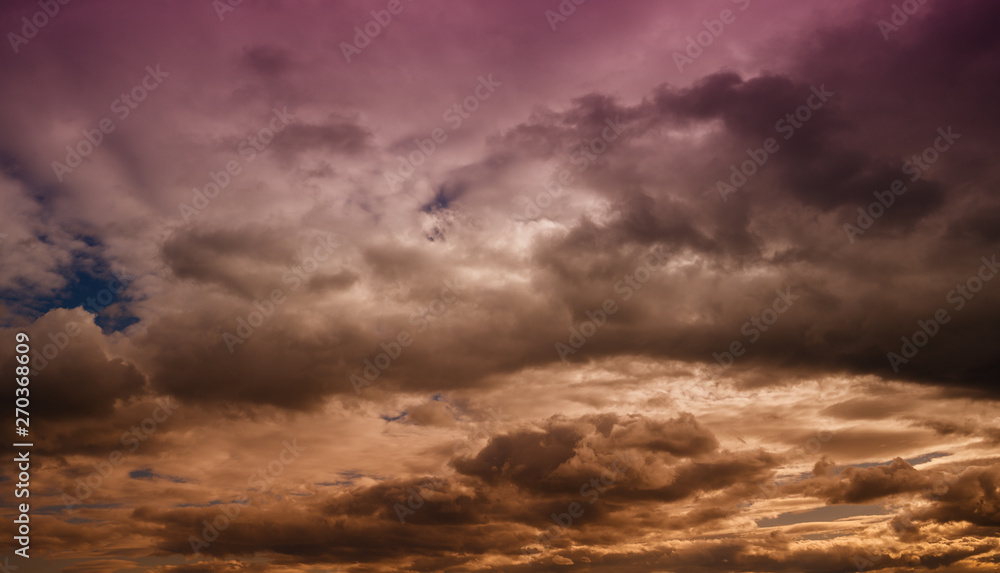 Fototapeta premium Beautiful colorful sky with clouds and sunlight. Color toned.