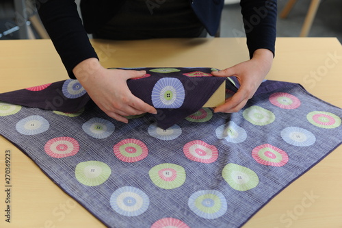 Furoshiki traditional Japanese ecological gift wrapping cloth and technique demonstration