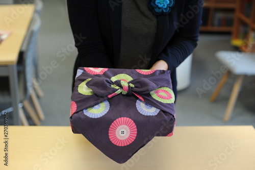 Furoshiki traditional Japanese ecological gift wrapping cloth and technique demonstration