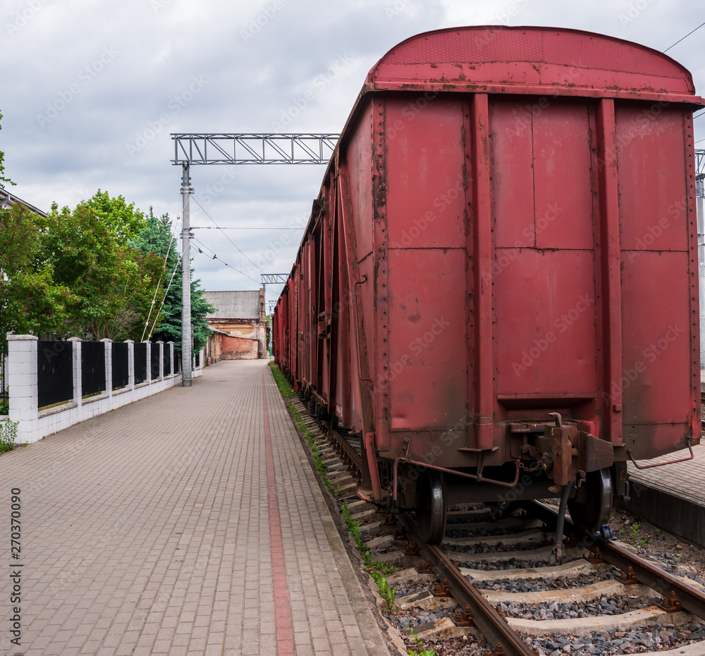 Fototapeta premium Cargo wagon in the train station.