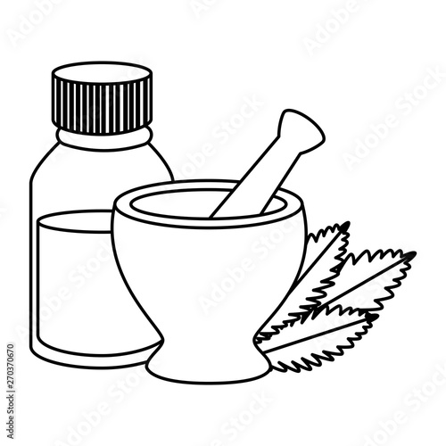 pill grinder with cannabis leafs and bottle