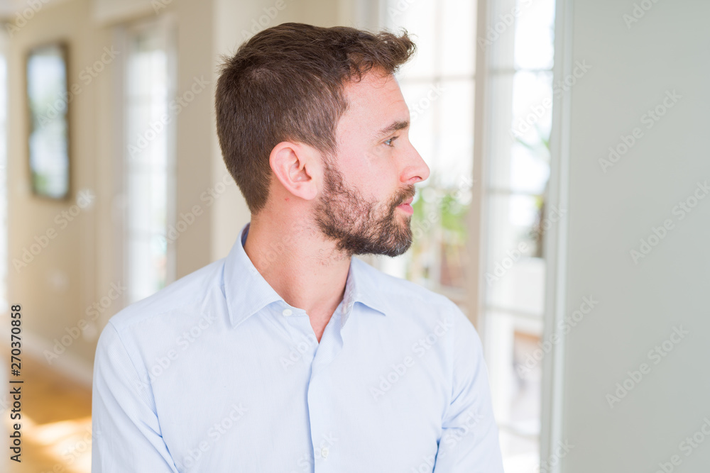 Handsome business man looking to side, relax profile pose with natural face with confident smile. Handsome business man looking to side, relax profile pose with natural face with confident smile.