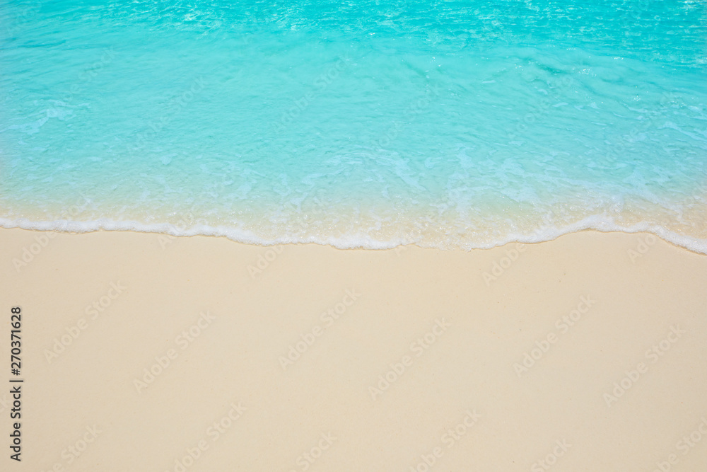 Soft waves of blue sea on the Maldives beach for the background. Soft waves of blue sea on the Maldives beach for the background.