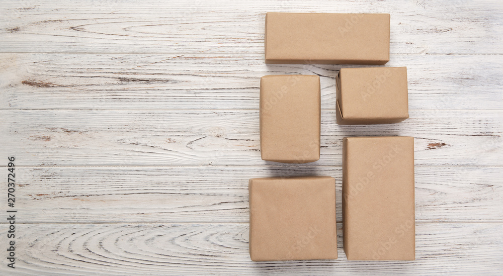 cardboard box on white wooden background, Brown mail package top view cardboard box on white wooden background, Brown mail package top view