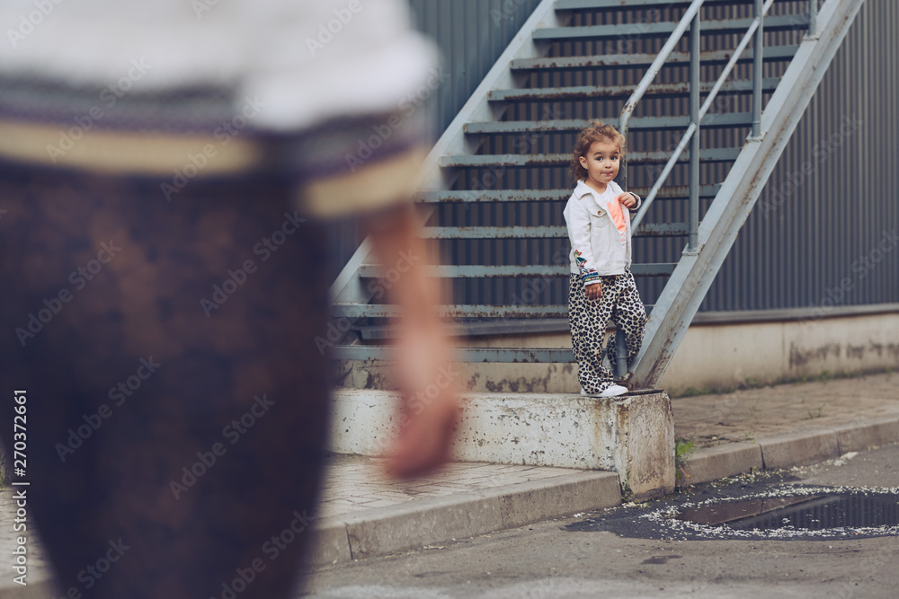 Cheerful mother and daughter having fun in city Cheerful mother and daughter having fun in city