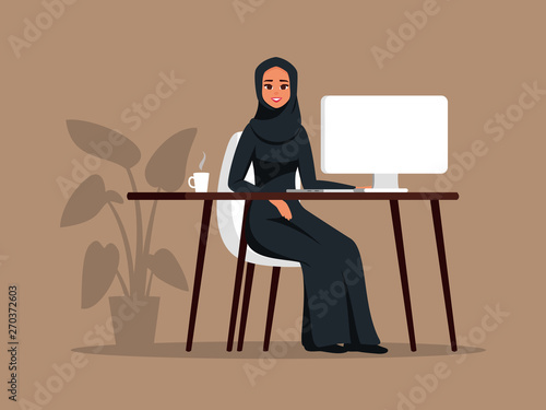Young Arab girl sitting at the table using the computer. Muslim business woman wearing hijab working at home or office. Color vector illustration in flat cartoon style.