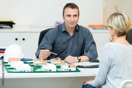 woman planning new house project with architect at office