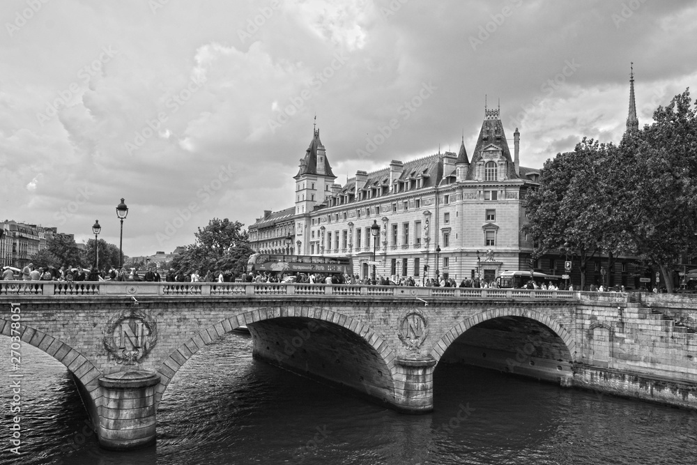 Paris,France-25.05.2019:Bridge Saint Michel and Castle Conciergerie(former royal palace.Conciergerie located on west of the Cite Island and it is part of larger complex known as Palais de Justice