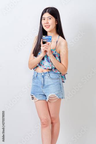 Woman holding Credit card summer holiday