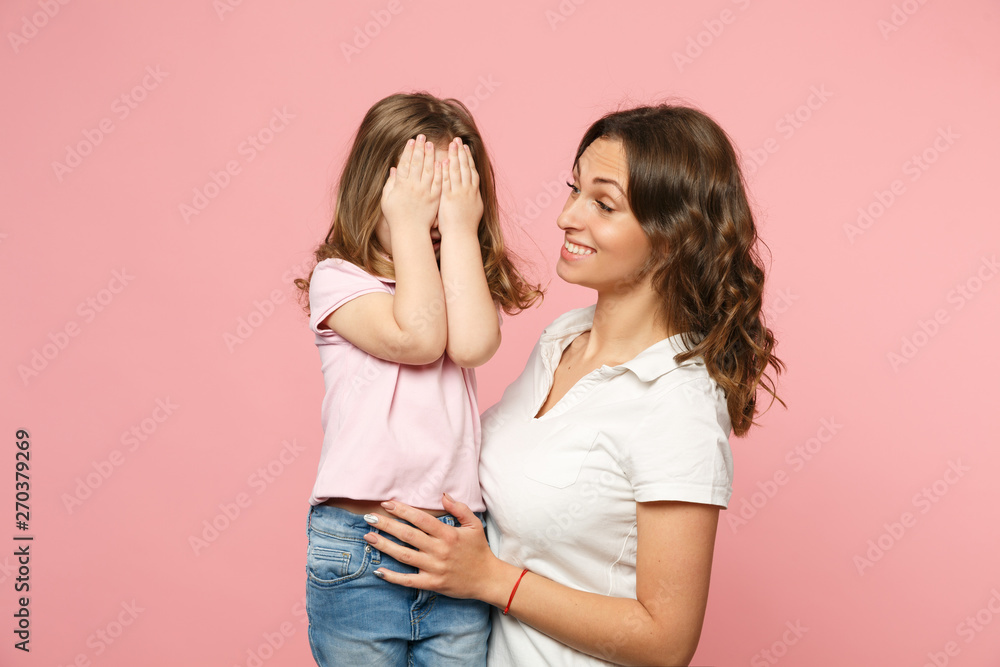 Woman in light clothes have fun with cute child baby girl. Mother, little kid daughter isolated on pastel pink wall background, studio portrait. Mother's Day, love family, parenthood childhood concept Woman in light clothes have fun with cute child baby girl. Mother, little kid daughter isolated on pastel pink wall background, studio portrait. Mother's Day, love family, parenthood childhood concept