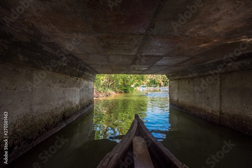 Canoe ride below bridge in Munroe Island