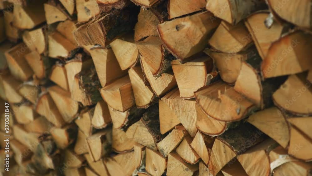 Logs of firewood stacked together. Medium shot Logs of firewood stacked together. Medium shot