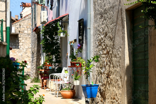 Colorful narrow street in Sibenik, Croatia. Sibenik is popular summer travel destination. © jelena990